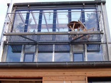 Glasaufbau mit Balkon